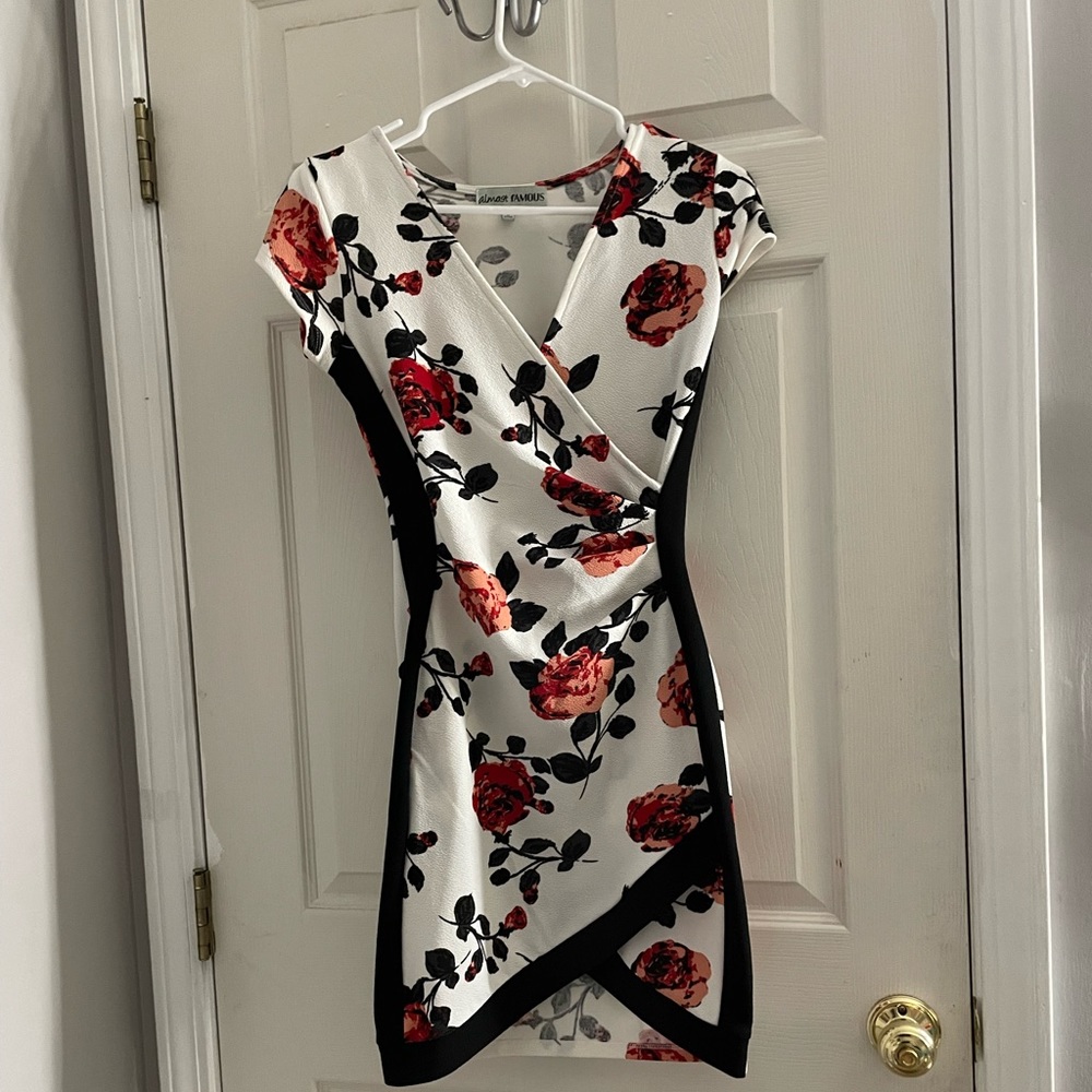 - Short body fitting dress  - size: S     - Deep V-neck